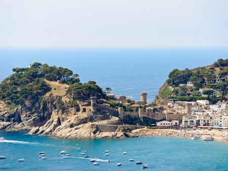 view of urban beach and Vila Vella monument in town Tossa de Mar, Costa Brava, Catalonia, Spainのeditorial素材