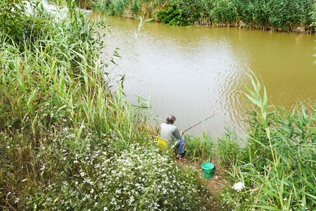 fisherman is fishing on riverbank, Kuban, Russiaの写真素材