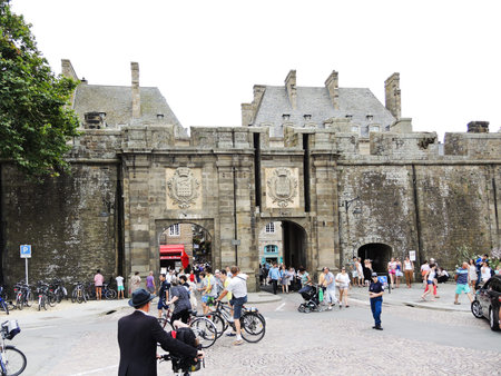 SAINT-MALO, FRANCE - AUGUST 9, 2014. People neat Saint Vincent Gate n Saint-Malo city. This gate is the main entrance of the city now and it was built in 1708.のeditorial素材