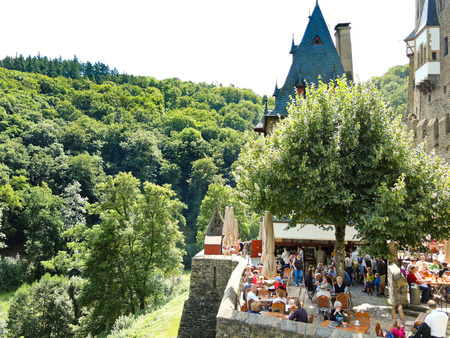 BURG ELTZ, GERMANY - AUGUST 12, 2014: tourists in Castle Eltz above Mosel river, Germany. The castle is still owned by a branch of same family that lived there in the 12th century, 33 generations agoのeditorial素材