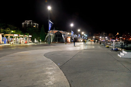 YALTA, RUSSIA - OCTOBER 2, 2014: people walking on waterfront in Yalta city in night. Yalta is resort city on the north coast of the Black Sea on the Crimean peninsula.のeditorial素材