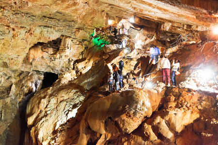 YALTA, RUSSIA - SEPTEMBER 29, 2014: tourists in in Yaltinskaya cave on Ai-Petri mountain plateau in Crimea.Yaltinskaya cave was discovered in 1997のeditorial素材
