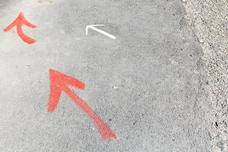few arrows - road pointers on pavement