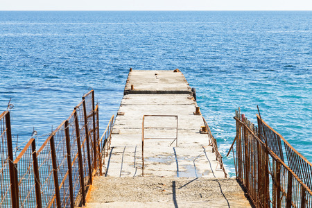 pier - breakwater in Black Sea on waterfront of Yalta city, Crimeaの写真素材