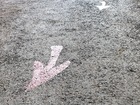 red arrows - road pointers on pavementの写真素材