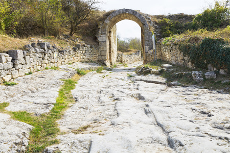 Gate on fortified Middle wall of ancient town chufut-kale, crimeaの写真素材