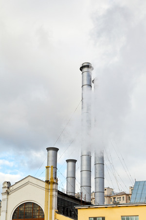 smoke from chimneys of district heating station in autumn dayのeditorial素材