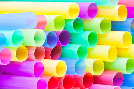 many-colored ends of multicoloured plastic drinking straws close upの写真素材