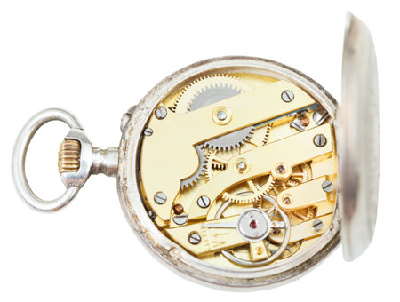 above view of brass clockwork of retro silver pocket watch isolated on white background