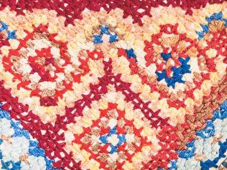 vintage knitting craftsmanship - cross stitch embroidery close upの写真素材