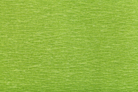 background from fibrous structure color green paper close upの写真素材