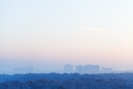 blue and pink sky over city in cold winter sunriseの写真素材