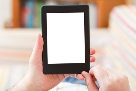 man read with e-book reader with cut out screen in living room