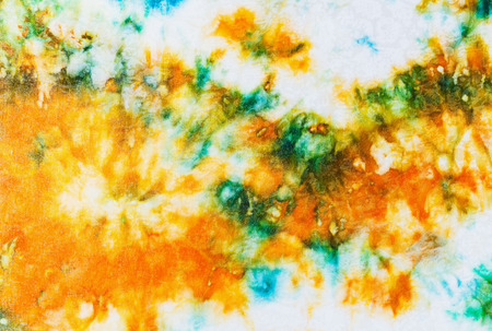 abstract pattern of batik painted on white silk close upの写真素材