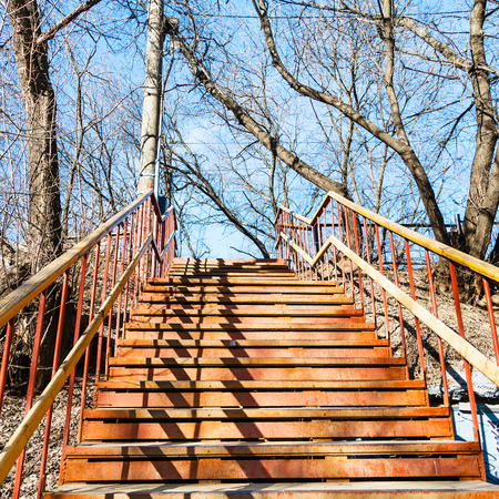 outdoor rusty metal steps on sunny spring dayの写真素材