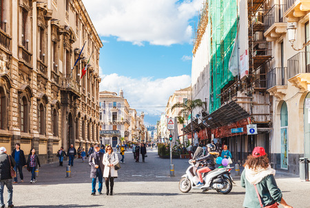 CATANIA, ITALY - APRIL 5, 2015: view of via Etnea and Etna volcano in Catania, Sicily, Italy. Etnea is the main street of historical center of Catania, it is about three kilometers long.のeditorial素材