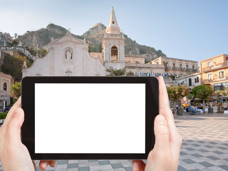 travel concept - tourist photograph Piazza IX Aprile near Chiesa di san Giuseppe, in Taormina,...