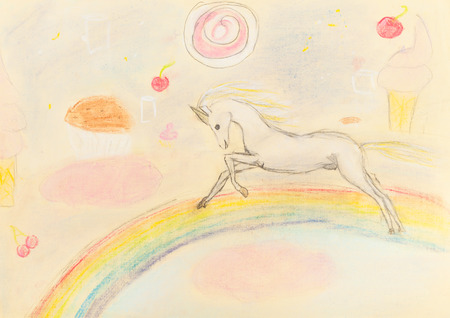 children drawing - fairy unicorn on rainbow by dry pastelの写真素材