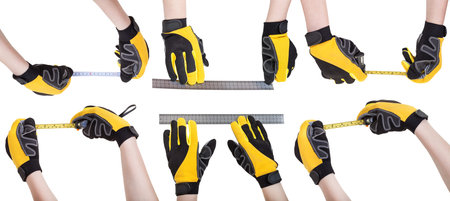 set of worker hands in safety gloves with measuring tools isolated on white backgroundの写真素材
