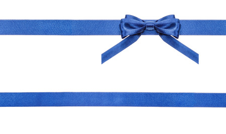 one blue satin bow in upper right corner and two horizontal ribbons isolated on horizontal white backgroundの写真素材