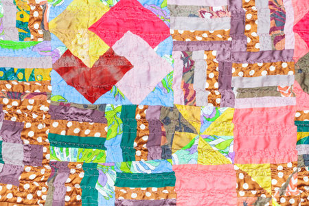 textile background from handmade silk patchwork cloth