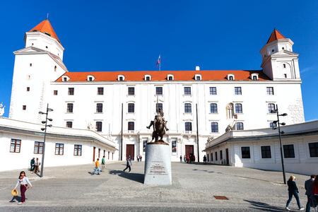 BRATISLAVA, SLOVAKIA - SEPTEMBER 23, 2015: tourists near statue of King Svatopluk I at the Honorary Courtyard of Bratislava castle. The statue was established in 2010のeditorial素材