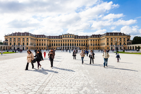 VIENNA, AUSTRIA - SEPTEMBER 29, 2015: tourists go from Schloss Schonbrunn palace to main entrance. Schonbrunn Palace is former imperial summer residence located Vienna city.のeditorial素材