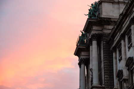 travel to Vienna city - pink sunrise and Neue Burg of Hofburg Palace in Vienna,Austriaのeditorial素材