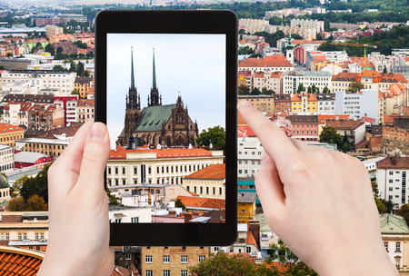 travel concept - tourist snapshot of Cathedral of St Peter and Paul in Brno town on tablet pcの写真素材