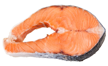 raw frozen steak of atlantic salmon isolated on white backgroundの写真素材