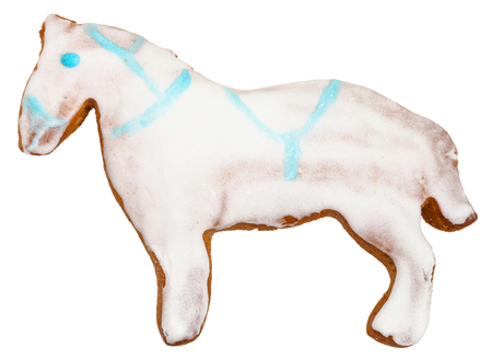 homemade Christmas festive glazed gingerbread cookie - horse figure cookie isolated on white backgroundの写真素材