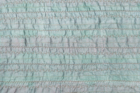 textile background - handmade stitched green fabric