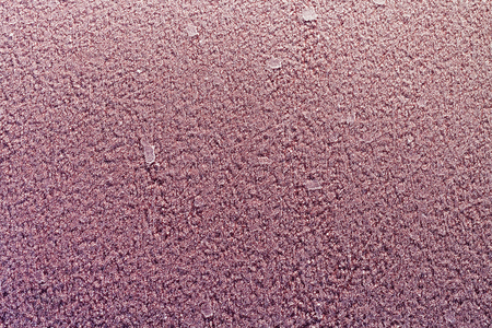 natural background - frozen water drops on red metal plate in winterの写真素材