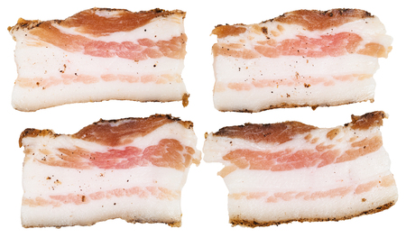 four pieces of speck isolated on white backgroundの写真素材