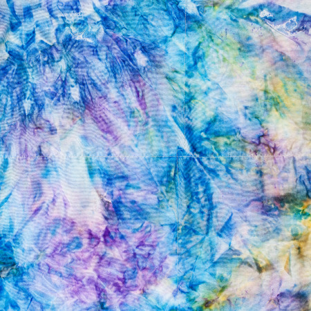 textile background - abstract blue and yellow colored stitched silk batikの写真素材