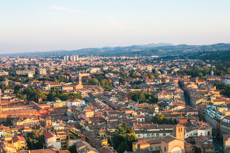 travel to Italy - above view of residential area in Bologna city from Torre Asinelli ( Asinelli Tower) at sunsetの写真素材