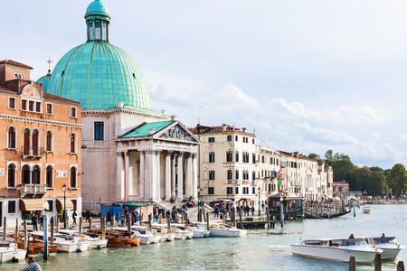 VENICE, ITALY - OCTOBER 11, 2016: tourists and boats near Church San Simeone Piccolo (San Simeone e Giuda) in Venice. The church was built in 1718-38 by Giovanni Antonio Scalfarotto.のeditorial素材