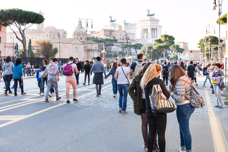 ROME, ITALY - OCTOBER 31, 2016: tourists walk on Via dei Fori Imperiali. It is road in the centre of Rome city that runs in a straight line from the Piazza Venezia to the Colosseumのeditorial素材