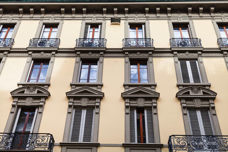 travel to Italy - facade of old urban building with windows and balconies in Florence cityの写真素材