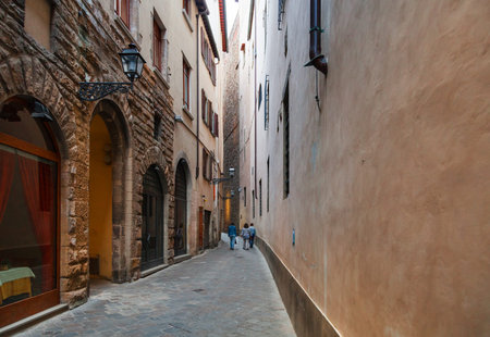 travel to Italy - long narrow street in historic district of Florence cityの写真素材