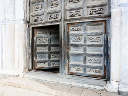 CEFALU, ITALY - JUNE 25, 2011: old doors of Duomo di Cefalu in Sicily. Cathedral - Basilica of Cefalu was erected in 1131 in the Norman architectural styleのeditorial素材