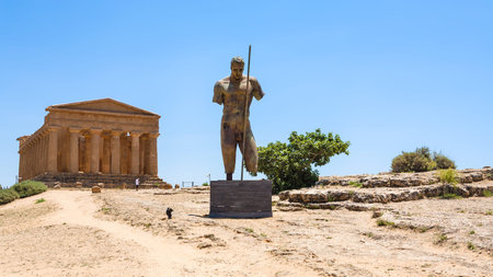 AGRIGENTO, ITALY - JUNE 29, 2011: statue and Temple of Concordia in Valley of the Temples in Sicily. This area has largest and best-preserved ancient Greek buildings outside of Greece itselfのeditorial素材