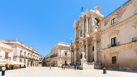 SYRACUSE, ITALY - JULY 3, 2011: tourists near Cathedral on piazza Duomo in Syracuse city in Sicily. The city is a historic town in Sicily, the capital of the province of Syracuse.のeditorial素材