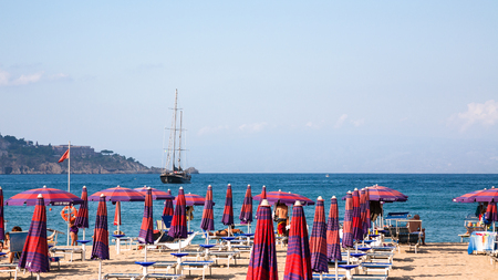 GIARDINI NAXOS, ITALY - JULY 6, 2011: view of urban beach in Giardini Naxos village afternoon. Naxos was founded by Thucles the Chalcidian in 734 BC, and since 1970s it has become a seaside-resortのeditorial素材