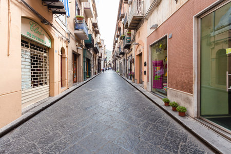 CEFALU, ITALY - JUNE 25, 2011: Corso Ruggero street in Cefalu in Sicily. The town is one of the major tourist attractions in the Palermo - Messina region, every year it attracts millions of touristsのeditorial素材