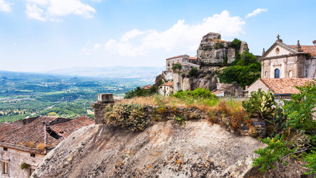 Italy - view of Lauria Castle (Castello di Lauria, Castle of Roger of Lauria) and Basilica della Madonna della Catena in Castiglione di Sicilia town in Sicilyのeditorial素材