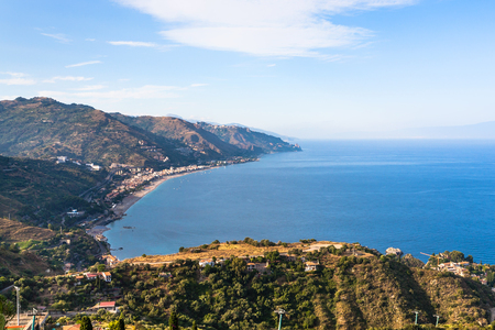 Italy - view of Letojanni resort and coast of Ionian sea from Taormina city in Sicily in summer twilightの写真素材