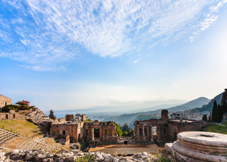 Italy - blue twilight sky over ancient Teatro Greco (Greek Theatre) in Taormina city in Sicilyの写真素材