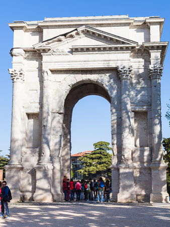 VERONA, ITALY - MARCH 29, 2017 - tourists near Arco dei Gavi in Verona city in spring. Arch was built in the second half of the first century, in 1930 the arch was restored from the preserved materialのeditorial素材