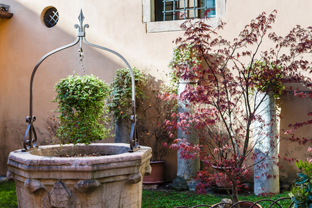 VERONA, ITALY - MARCH 29, 2017 - garden in cloister in Chiesa di San Lorenzo in Verona city. Church at this site was present since the 4th century, present church was rebuilt in the 12th centuryのeditorial素材